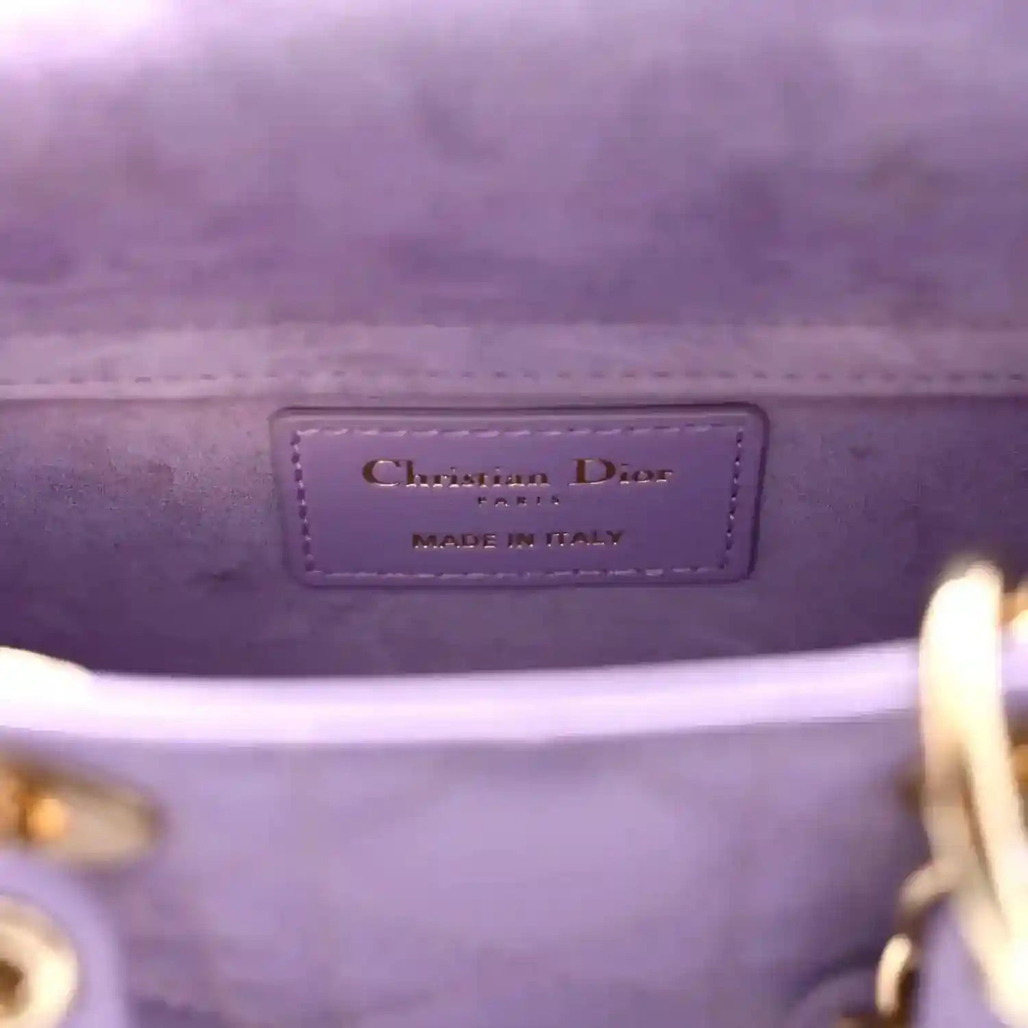 Christian Dior bag interior label reading 'MADE IN ITALY' on lilac leather
