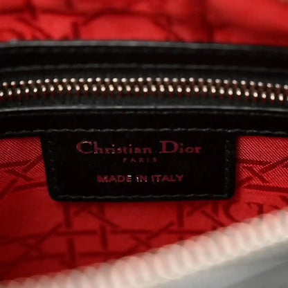 Lady Dior handbag interior label reading “Christian Dior” and “MADE IN ITALY”