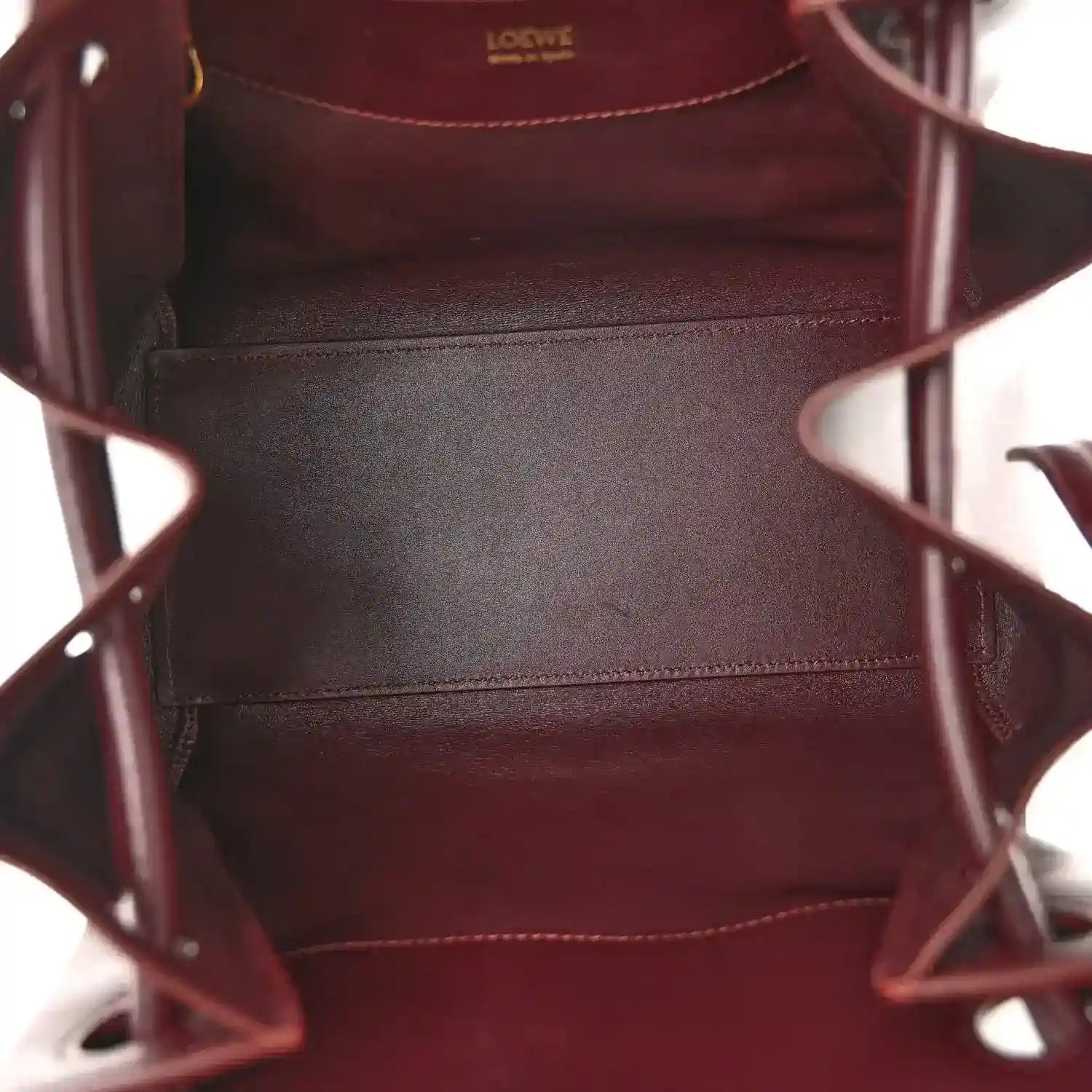 Loewe Small Madrid bag interior with burgundy leather lining and stitched seams