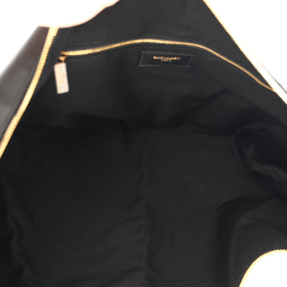 Black lambskin hobo bag interior lining with gold zipper trim and logo patch