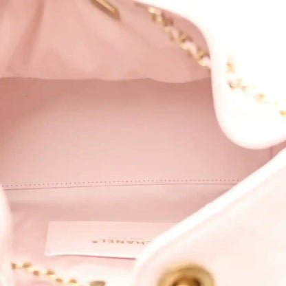 Chanel light pink handbag interior with stitched edge and gold hardware