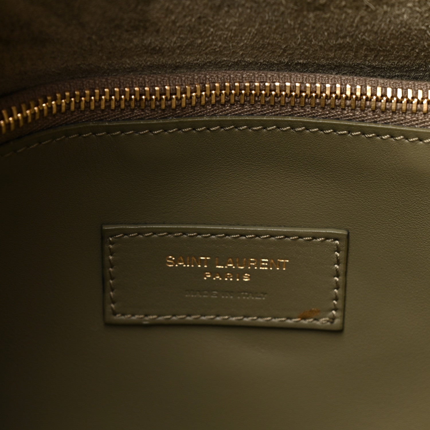Saint Laurent Paris leather bag interior label with gold zipper