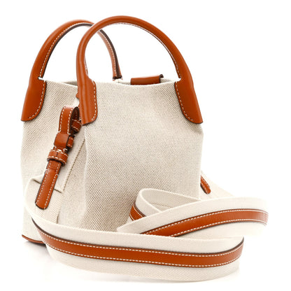 Loro Piana micro bale bag, natural canvas with tan leather handles and crossbody strap.