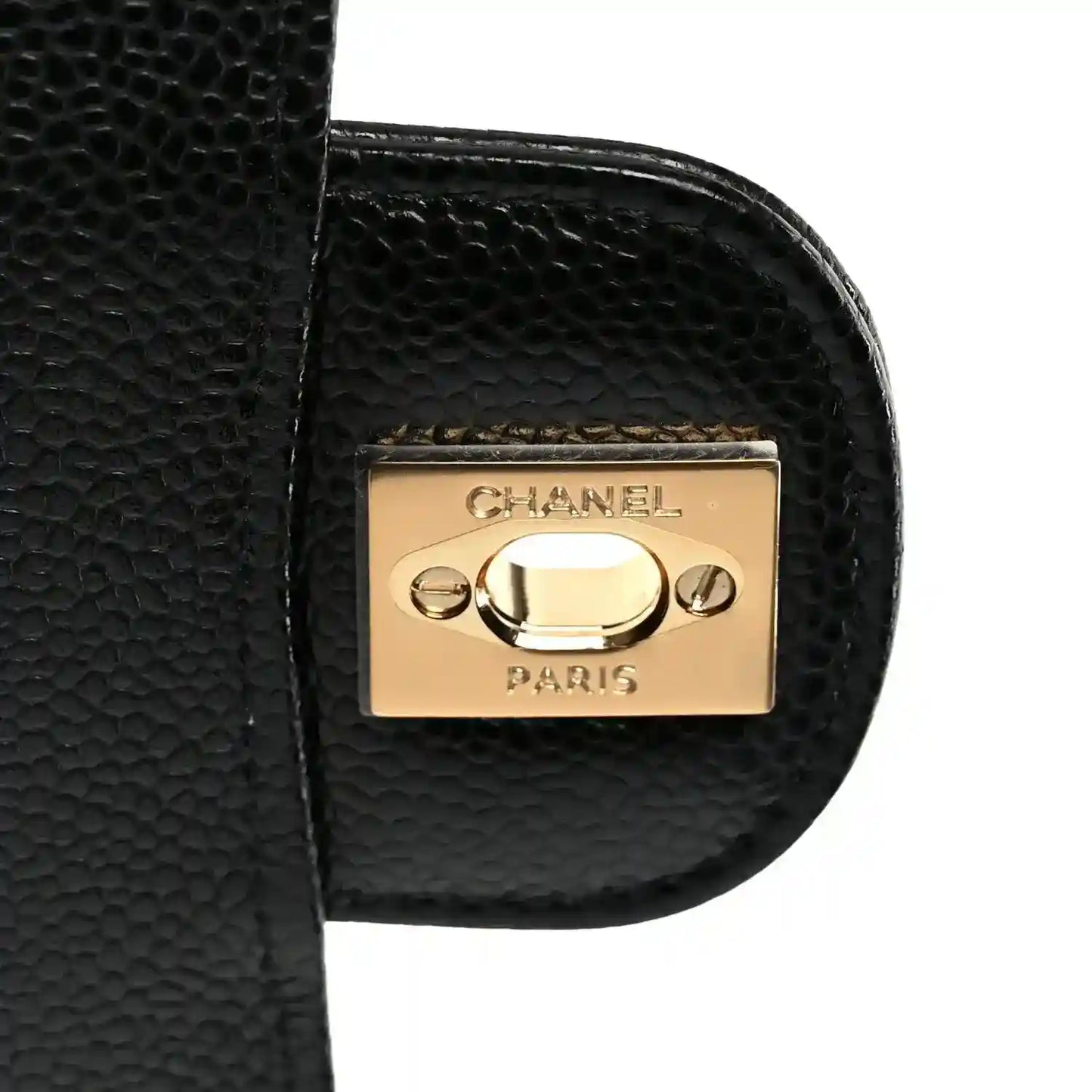 Chanel gold-tone hardware plate on black quilted leather flap edge