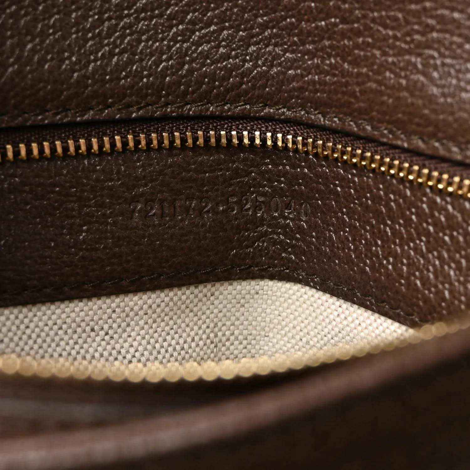 Medium top-handle bag inner pocket with gold-tone zipper and brown leather lining