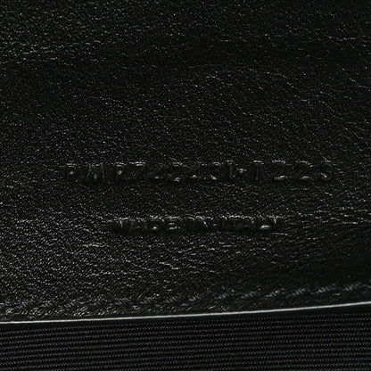 Leather brand stamp on black lining with SAINT LAURENT PARIS text
