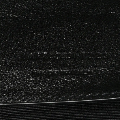 Leather brand stamp on black lining with SAINT LAURENT PARIS text