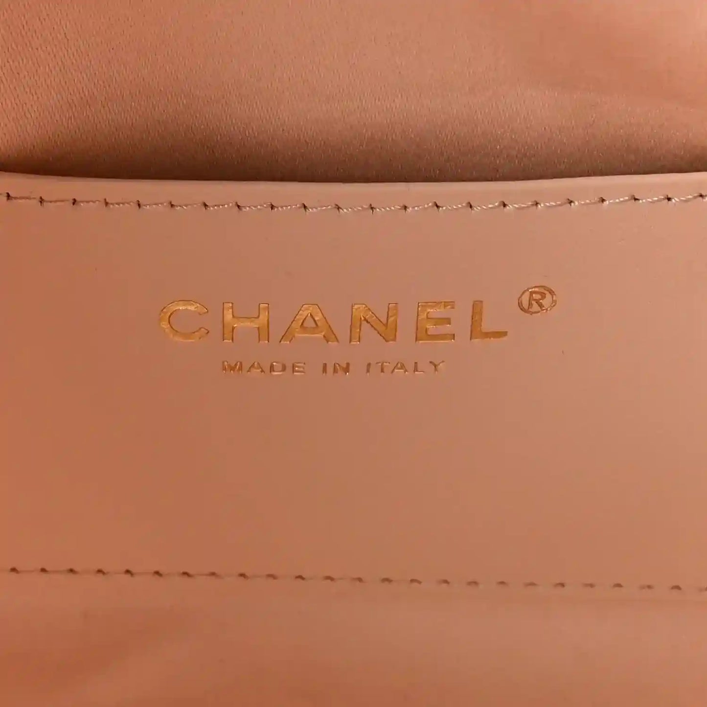 Chanel designer logo on copper leather lining, with Made in Italy text.