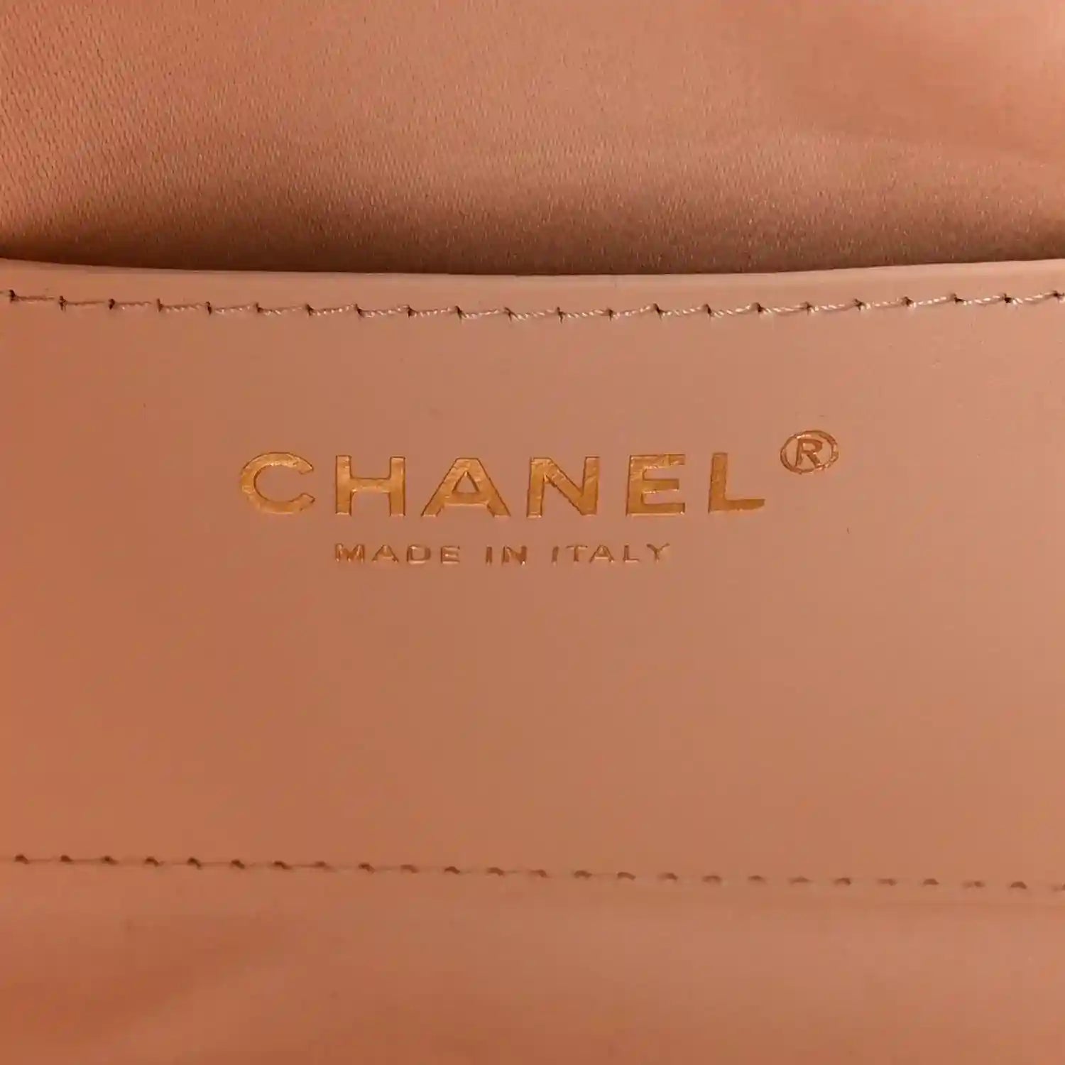 Chanel designer logo on copper leather lining, with Made in Italy text.