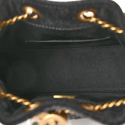 Black leather interior pocket with visible stitching and gold chain hardware