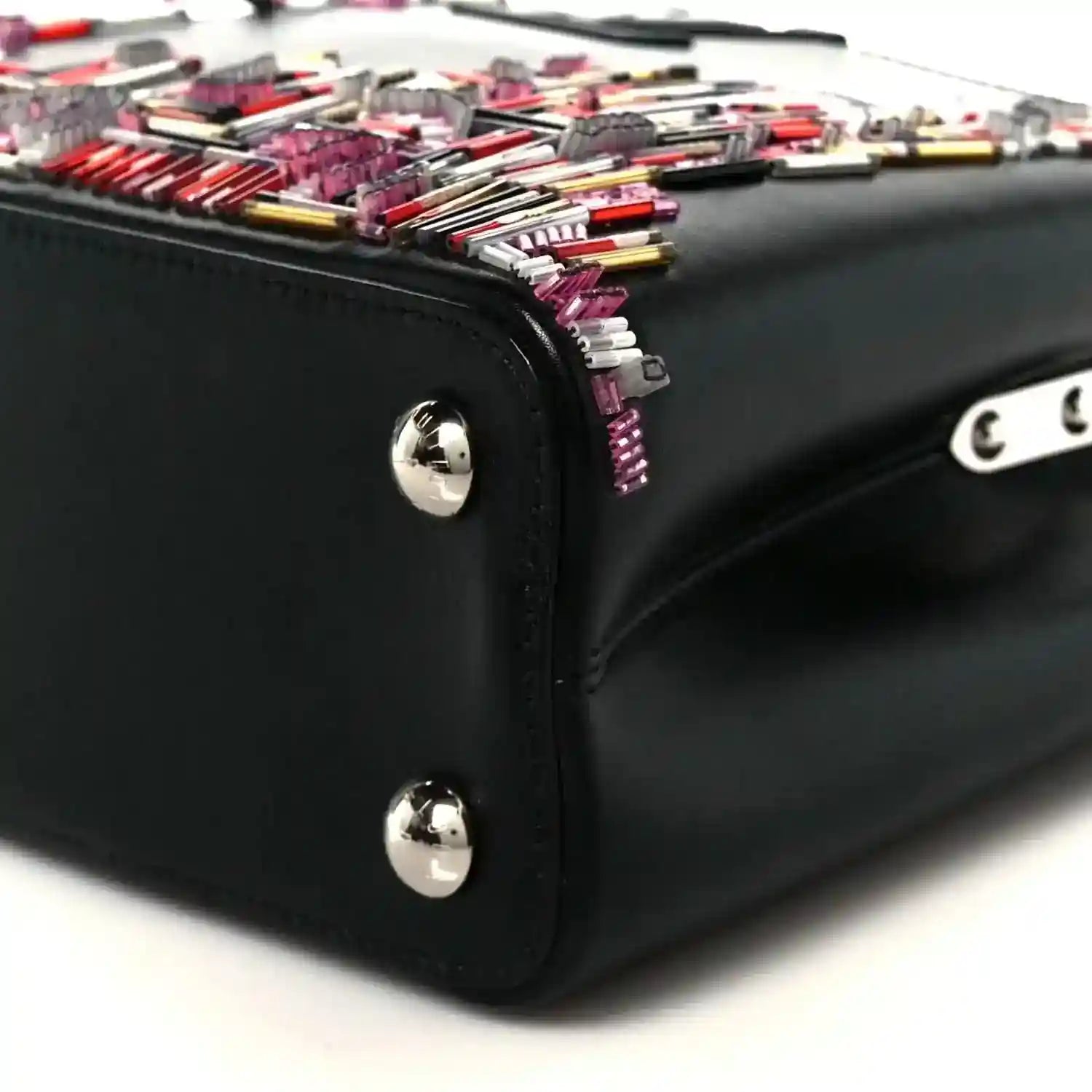 Capucines BB black bag corner with silver knobs and colorful beaded skyline top