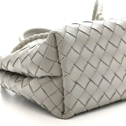 Andiamo shoulder bag side view in sterling grey woven nappa with braided strap