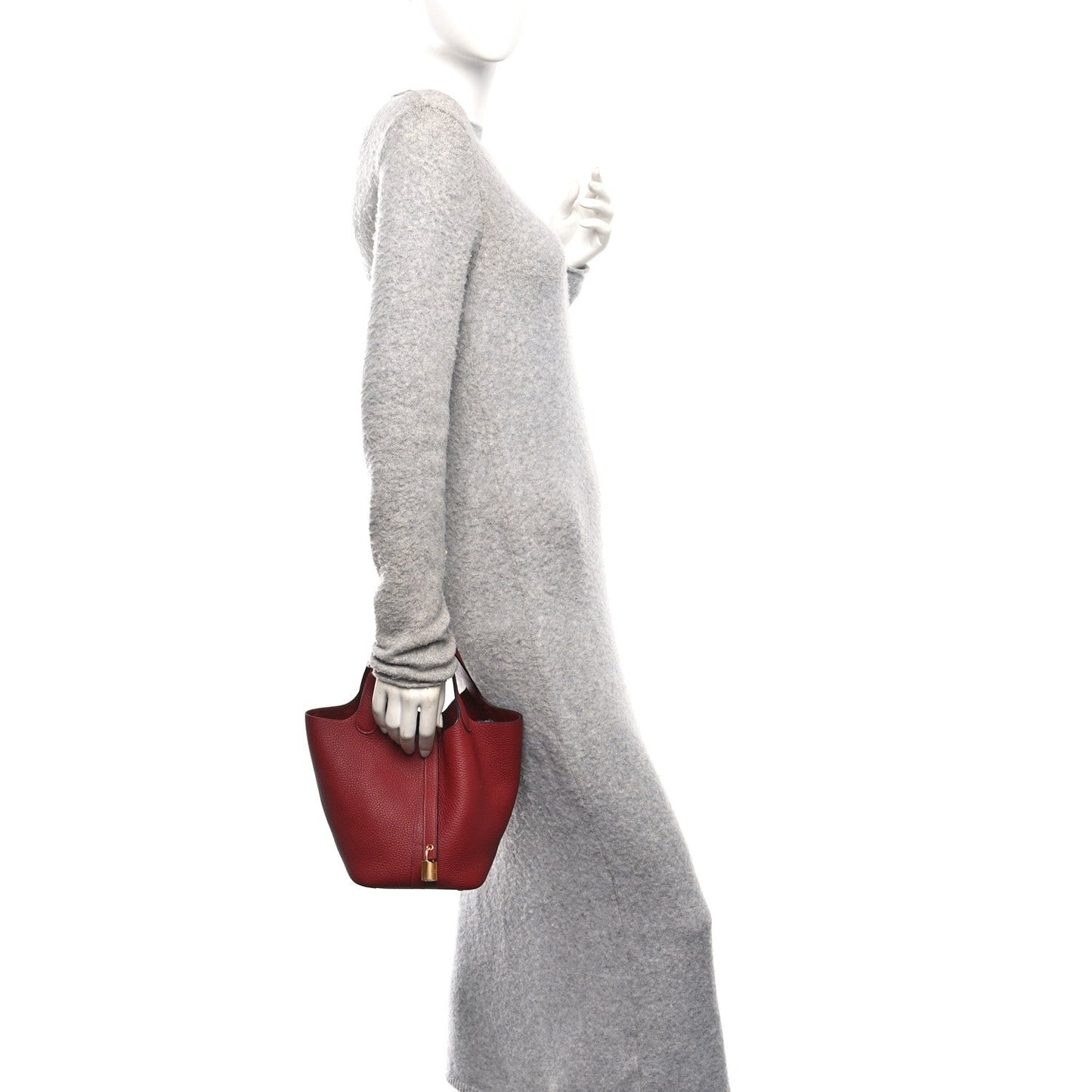 Burgundy leather tote on shoulder carry with gold-tone lock clasp