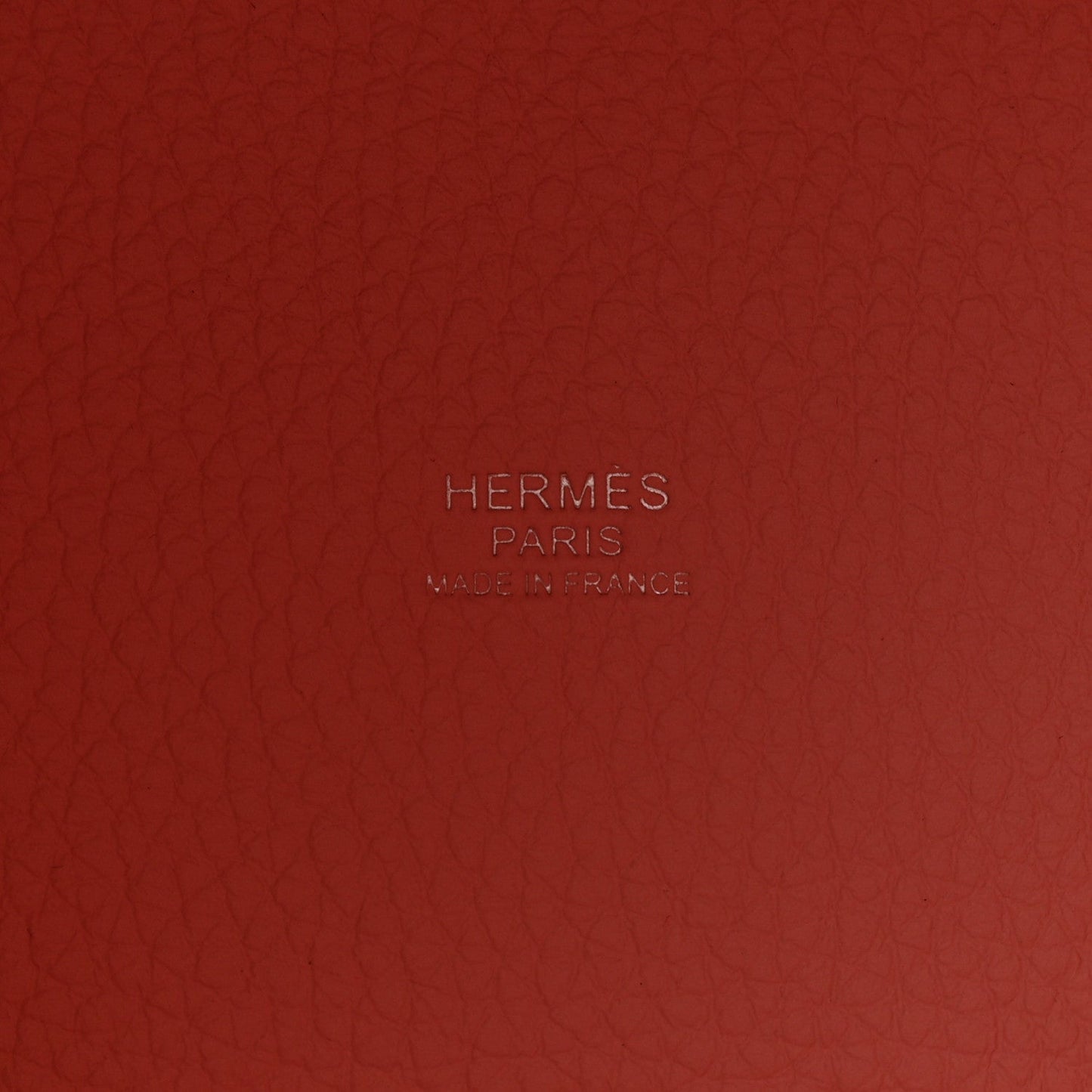 Rose pink embossed leather panel with HERMES PARIS logo