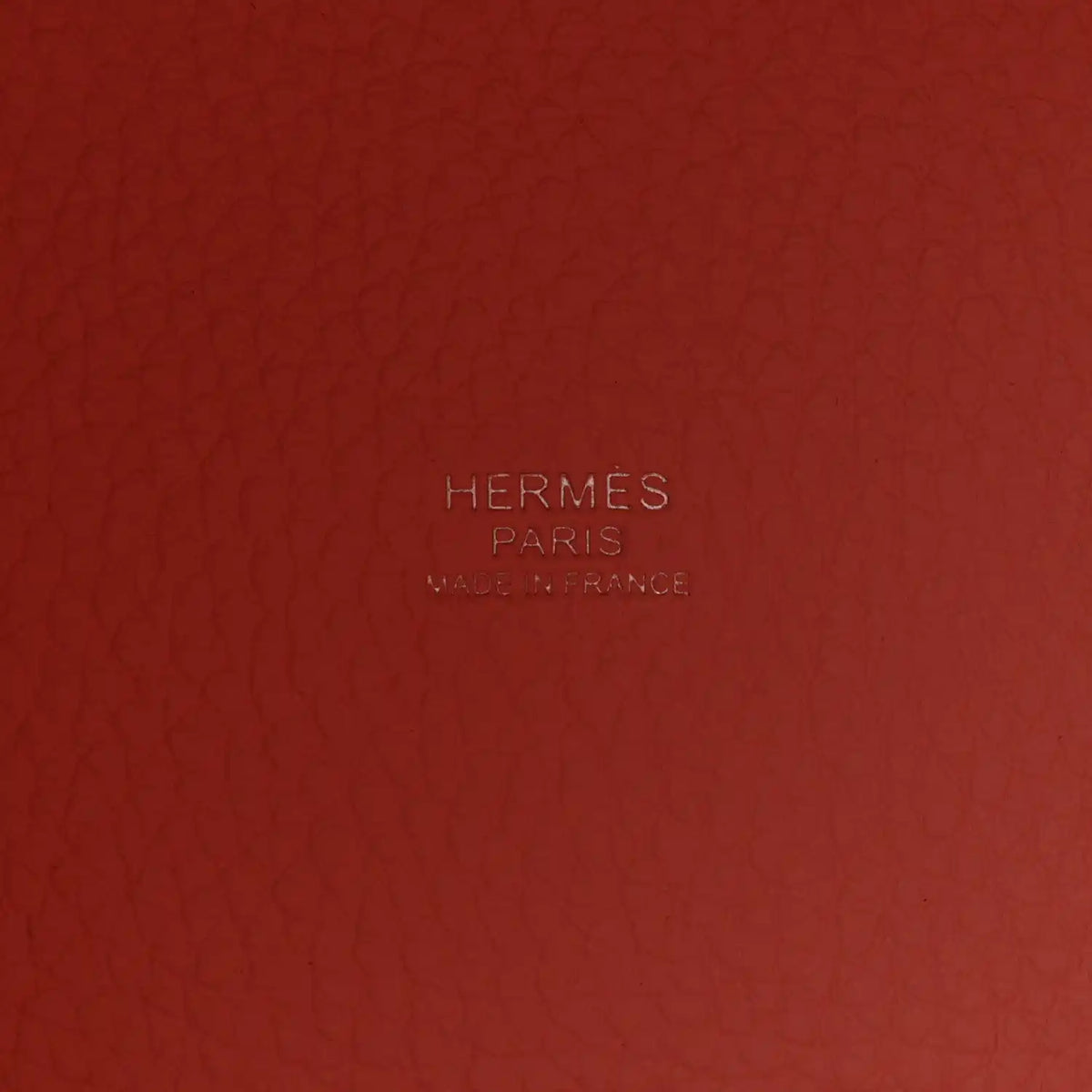 Rose pink embossed leather panel with HERMES PARIS logo