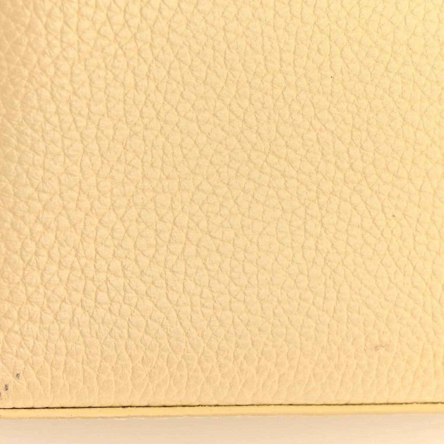 Louis Vuitton handbag panel with beige pebbled leather texture