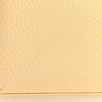 Louis Vuitton handbag panel with beige pebbled leather texture