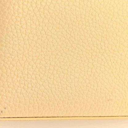 Louis Vuitton handbag panel with beige pebbled leather texture