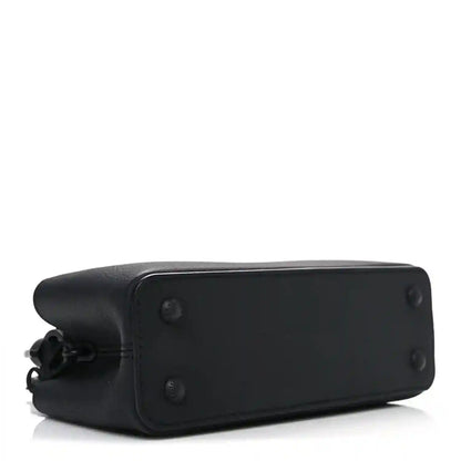 Mini black leather handbag base with corner seams and button details.