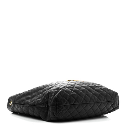 Black quilted leather pouch with gold-tone eyelet hardware and zip top