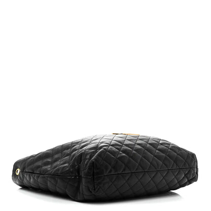 Black quilted leather pouch with gold-tone eyelet hardware and zip top