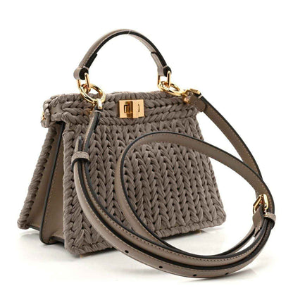 Gray woven raffia satchel with crossbody strap and gold-tone clasp