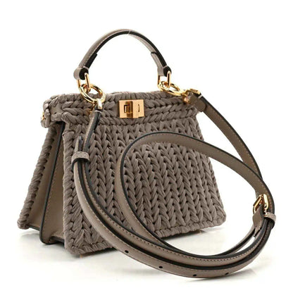 Gray woven raffia satchel with crossbody strap and gold-tone clasp