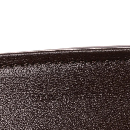 Leather edge seam with 'MADE IN' stamp.