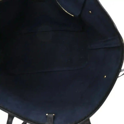 Neverfull MM tote bag interior lining with stitched seams, dark black