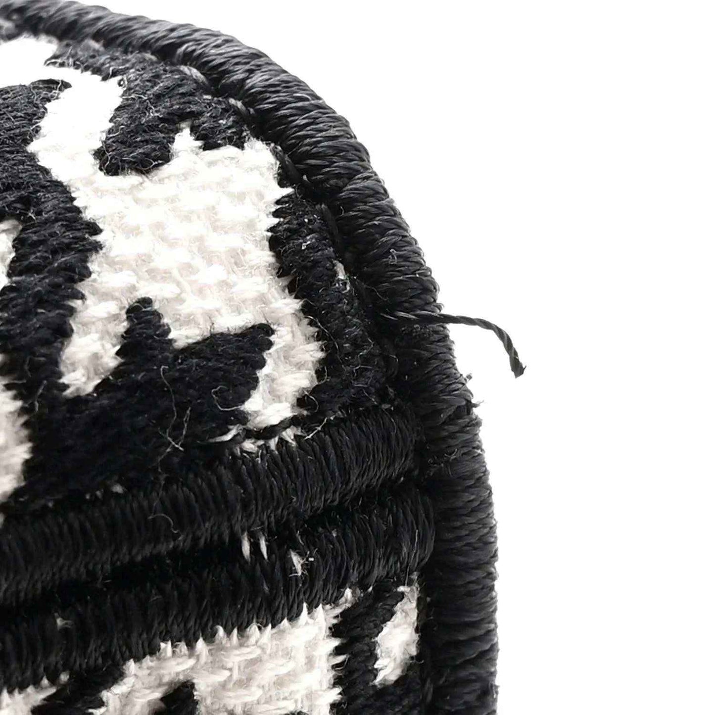 Houndstooth canvas bag with braided black and white top trim