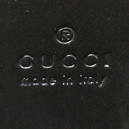 Black leather interior stamp reading Gucci and Made in Italy