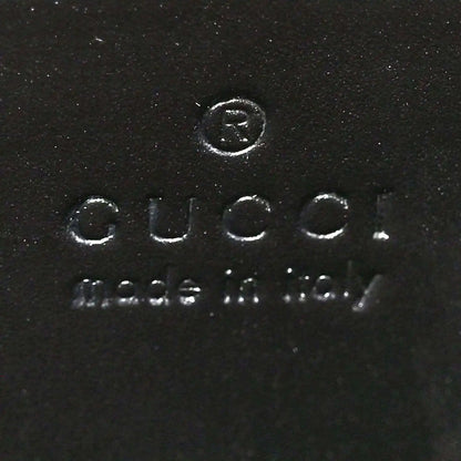 Black leather interior stamp reading Gucci and Made in Italy