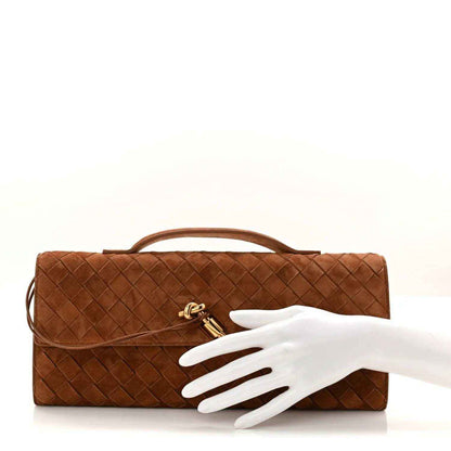 Amber-brown suede intrecciato top-handle clutch with front flap and gold clasp