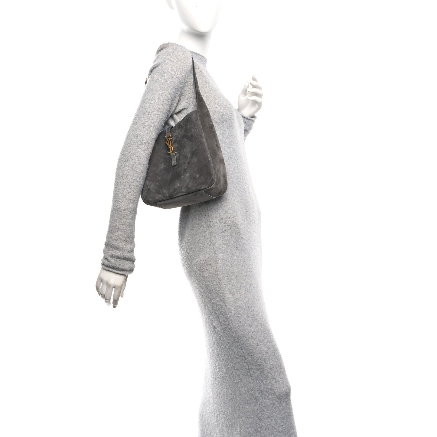 Grey suede hobo bag with top handle and YSL logo front, worn on shoulder