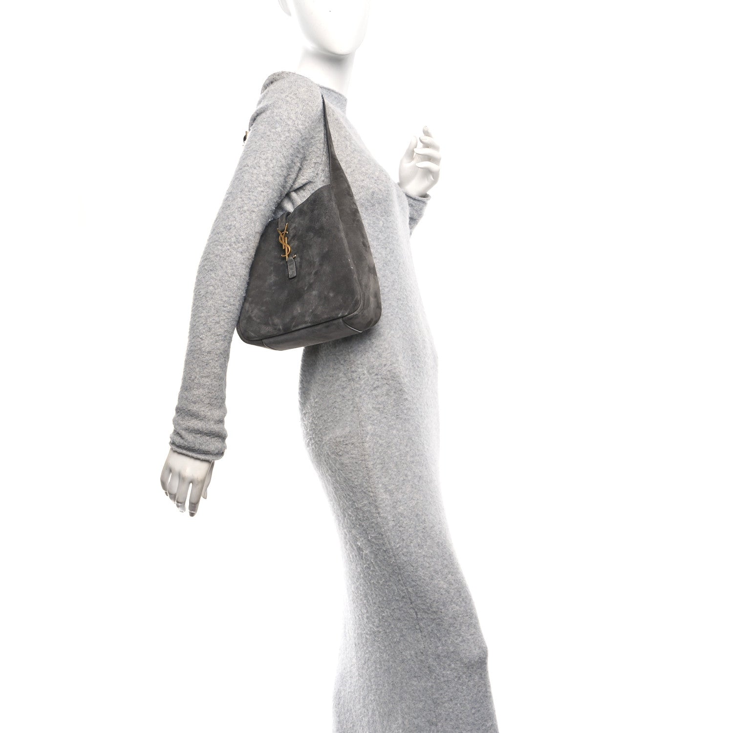 Grey suede hobo bag with top handle and YSL logo front, worn on shoulder