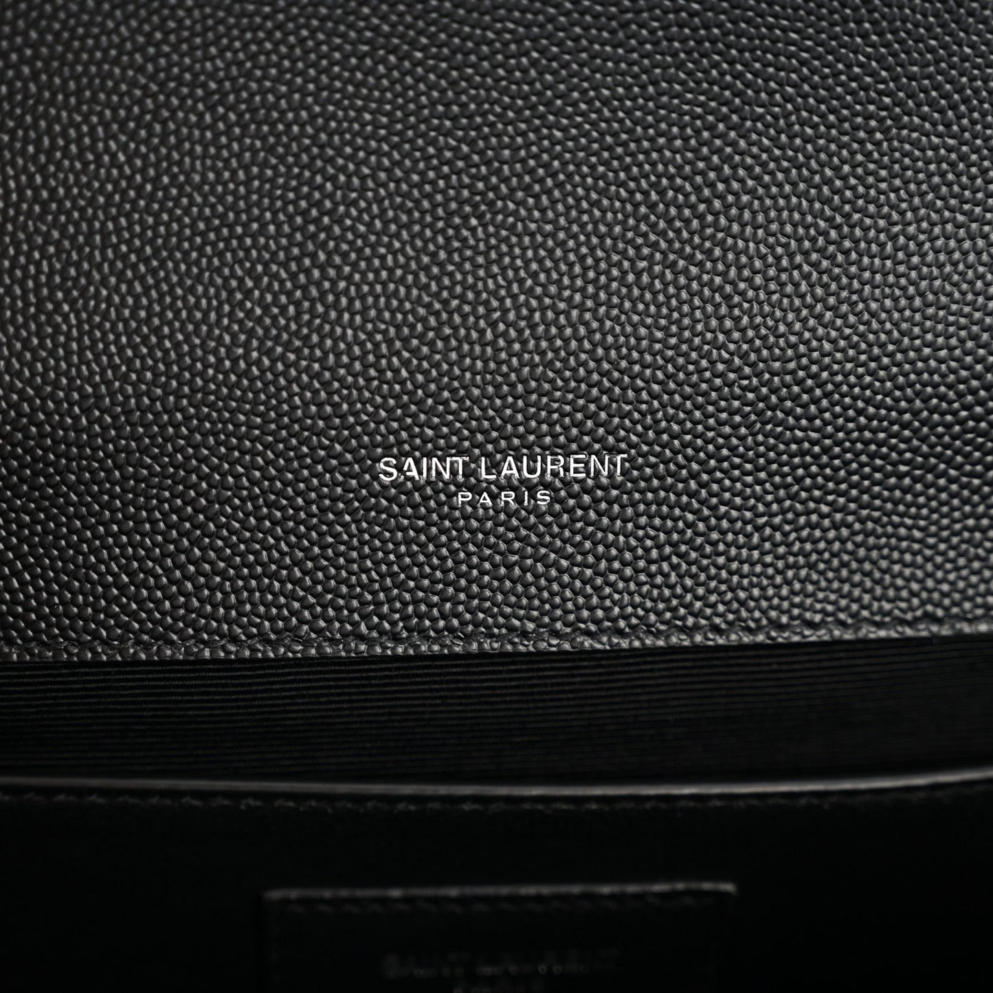 Black embossed leather satchel with SAINT LAURENT PARIS logo