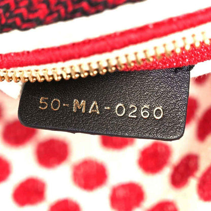 Black leather tag on bag reading 50 MA-0260