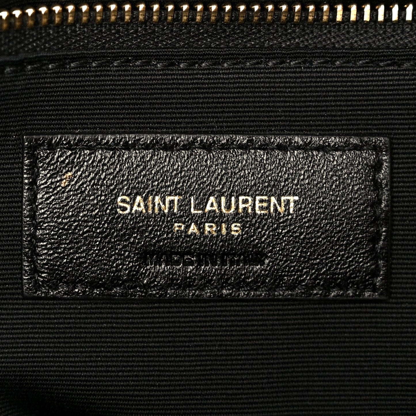 Dark grained lambskin satchel label with SAINT LAURENT PARIS stamp
