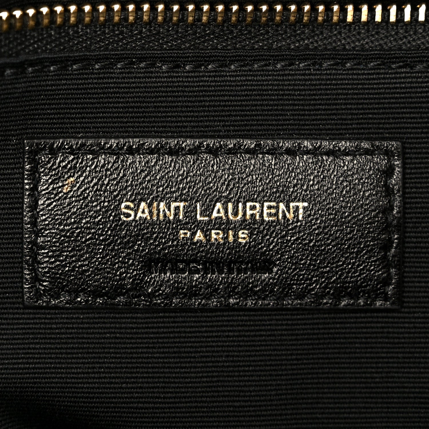 Dark grained lambskin satchel label with SAINT LAURENT PARIS stamp