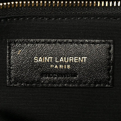 Dark grained lambskin satchel label with SAINT LAURENT PARIS stamp