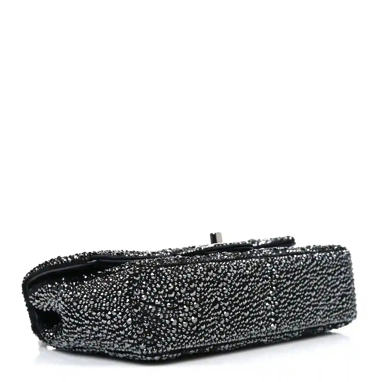 Black rhinestone small flap bag side view with top clasp bar and handle