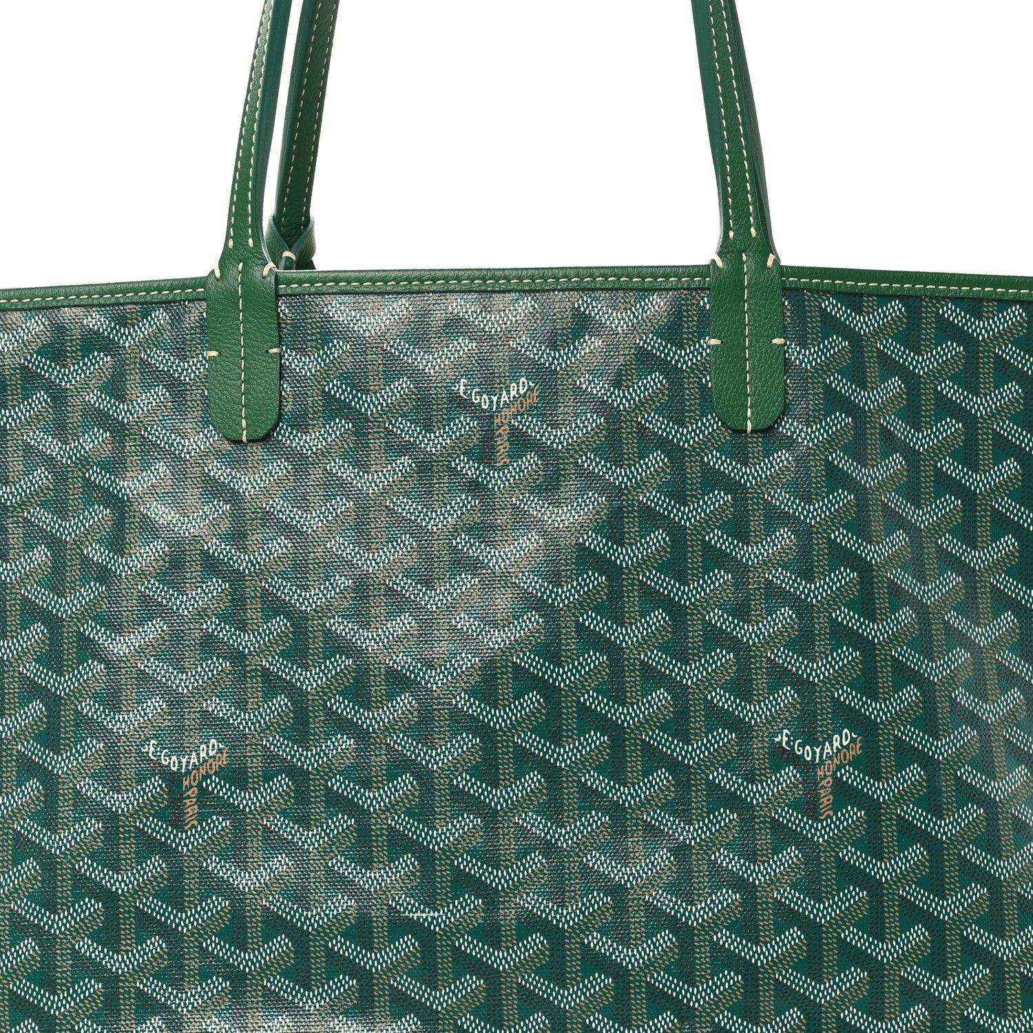 Close-up of green canvas tote bag with top handles and woven pattern