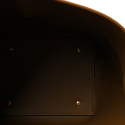 Suede bucket bag interior lining with side compartment and stitching, dark brown