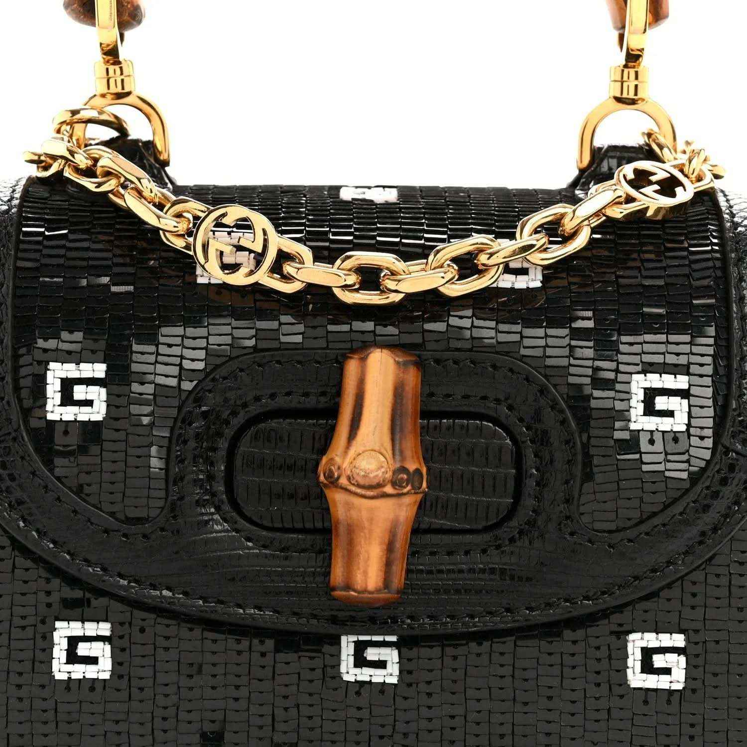 Gucci mini top handle bag front, black embossed lizard texture, bamboo tab and gold chain