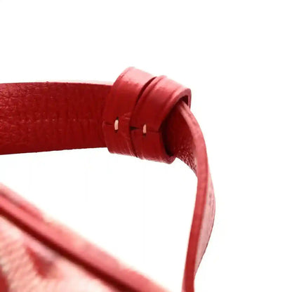 Red vanity case top handle with stitched leather strap and metal attachment ring