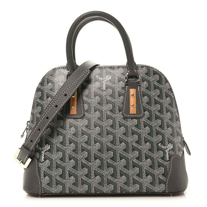 Grey coated canvas chevron handbag with leather handles and brown hardware accents.