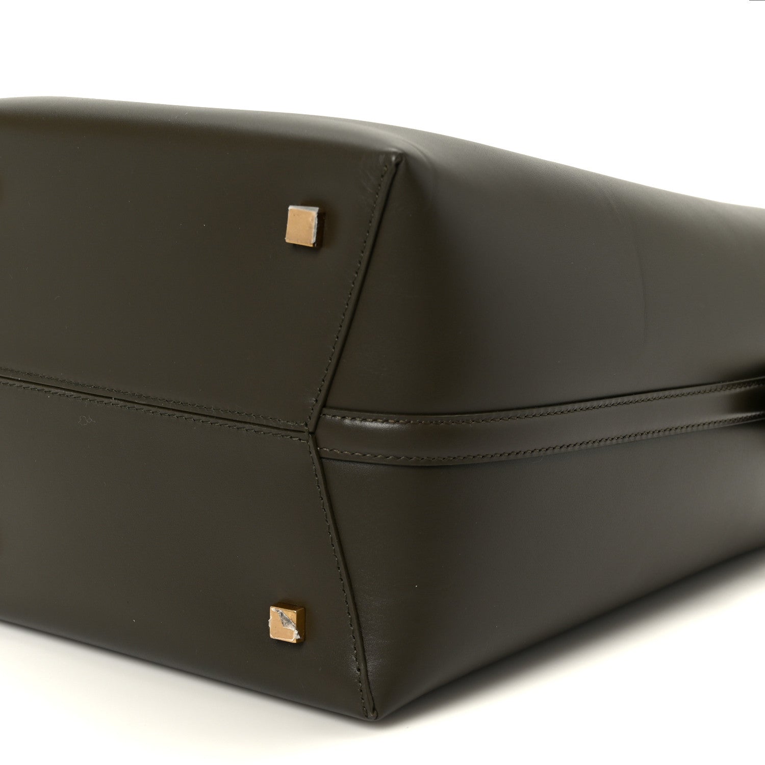 Shiny calfskin bucket bag in deep musk with gold-tone logo hardware, square base corner