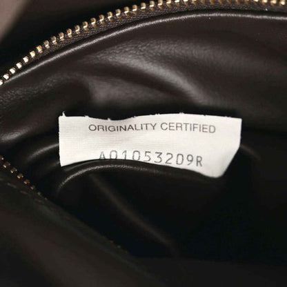 Bottega Veneta suede hobo bag authenticity label inside, near zipper, dark brown