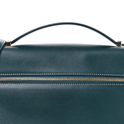 Petrolio teal leather bag top with arched handle and striped zipper trim