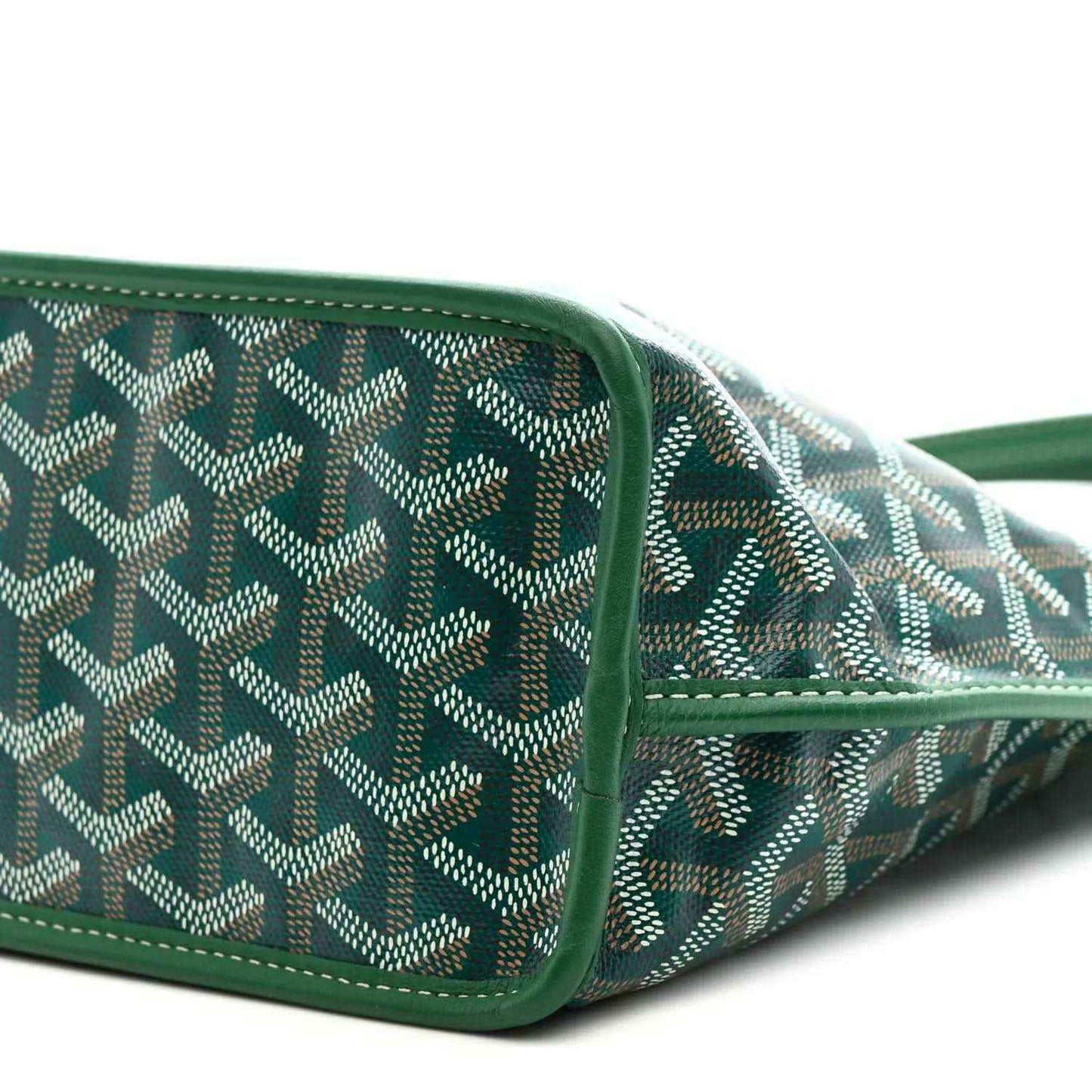 Patterned canvas tote corner with green trim and stitched seam